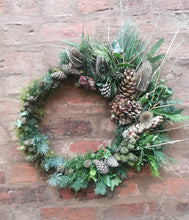 Load image into Gallery viewer, Green foliage asymetric christmas wreath.
